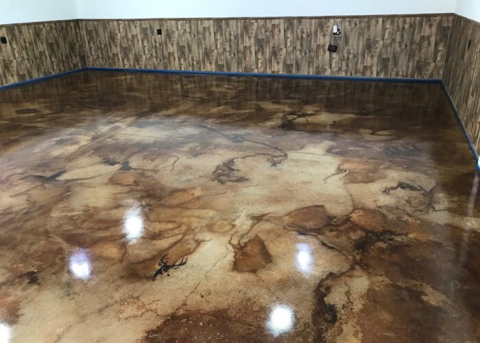 Wet-on-wet technique being used to apply Desert Amber, Cola, and Coffee Brown acid stains to garage floor