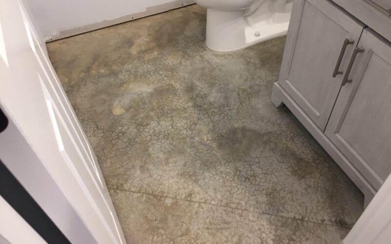 Unfinished bathroom area with bare concrete floor