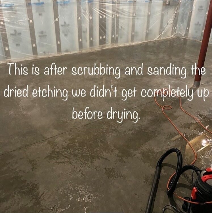 Image of concrete floor after sanding and scrubbing off the footprints etched on the surface, preparing the surface for acid staining.