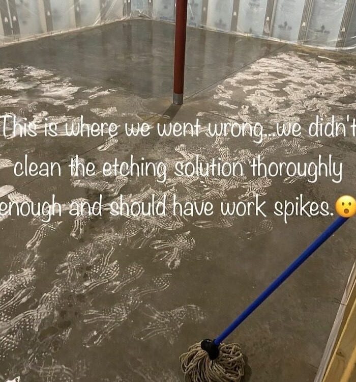 Image of footprints on the concrete floor caused by not wearing spiked shoes while applying etching solution, highlighting the importance of following safety precautions and thoroughly rinsing the etching solution.