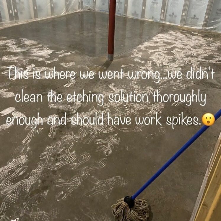 Image of footprints on the concrete floor caused by not wearing spiked shoes while applying etching solution, highlighting the importance of following safety precautions and thoroughly rinsing the etching solution.