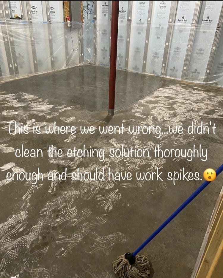 Image of footprints on the concrete floor caused by not wearing spiked shoes while applying etching solution, highlighting the importance of following safety precautions and thoroughly rinsing the etching solution.
