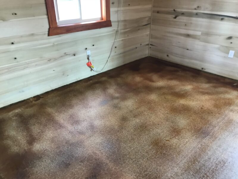 Finished cabin addition room, showcasing the blended warm tones of Cola and Malayan Buff acid stains