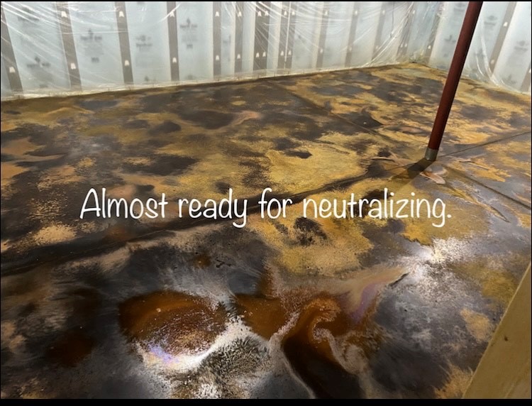 Reaction time process: The Coffee Brown acid stain has been applied over the dried Desert Amber, creating a beautiful layered effect. This photo shows the dry acid stains on the concrete floor before the neutralizing process.