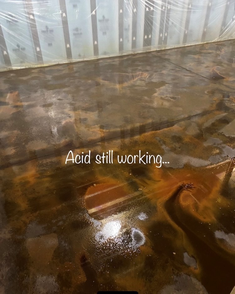 Image of Desert Amber and Coffee Brown acid stains reacting with the concrete floor, creating unique and one-of-a-kind coloring.