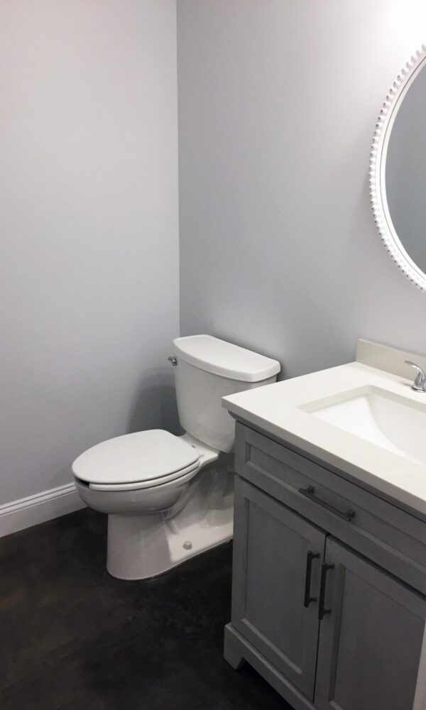 The same bathroom after applying Charcoal AcquaTint™, exhibiting a sophisticated and polished look