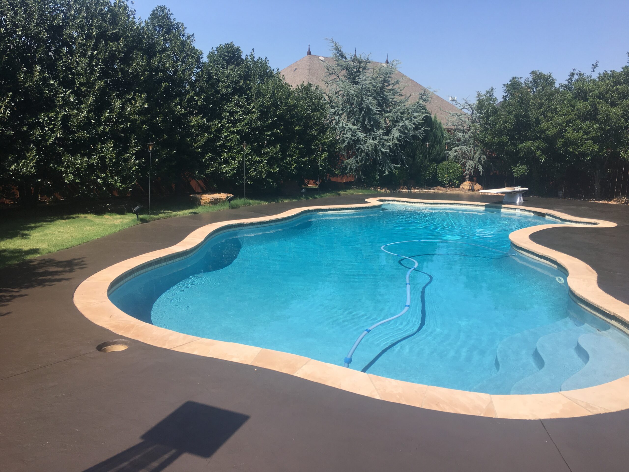 After: A stunning poolside oasis brought back to life with Resurface-It concrete overlay and Chocolate EasyTint