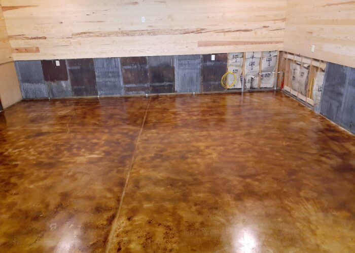 Drying coffee brown acid stain concrete garage floor after the application of high gloss EasySeal sealer.