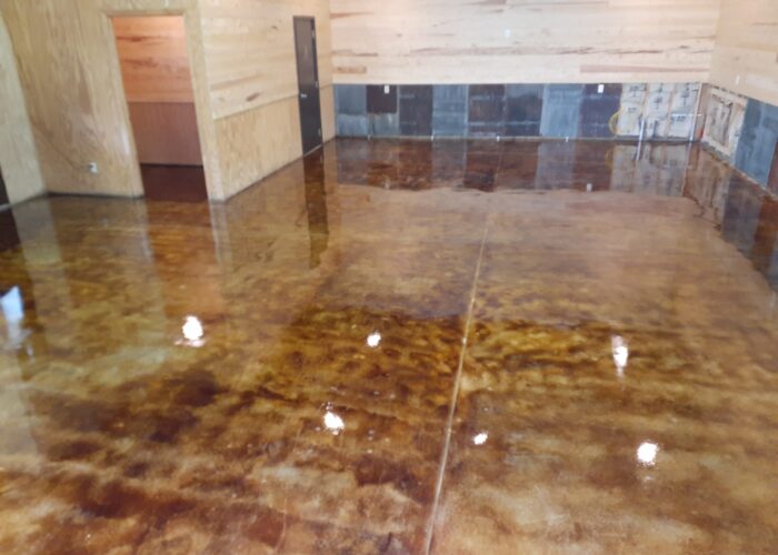 High gloss EasySeal sealer with Anti-Slip additive applied on coffee brown acid stain concrete surface with second coat