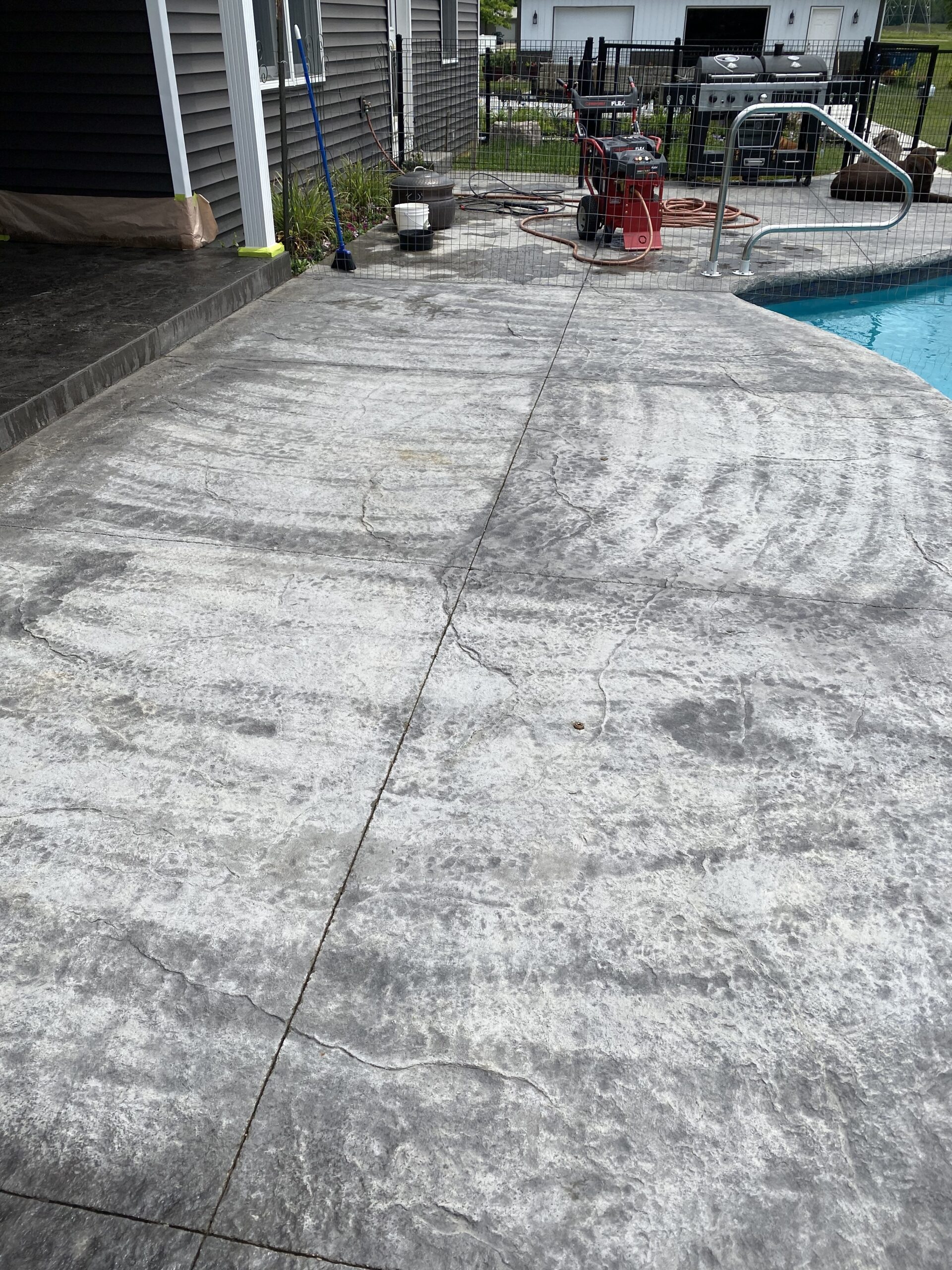 Damaged concrete pool deck stain