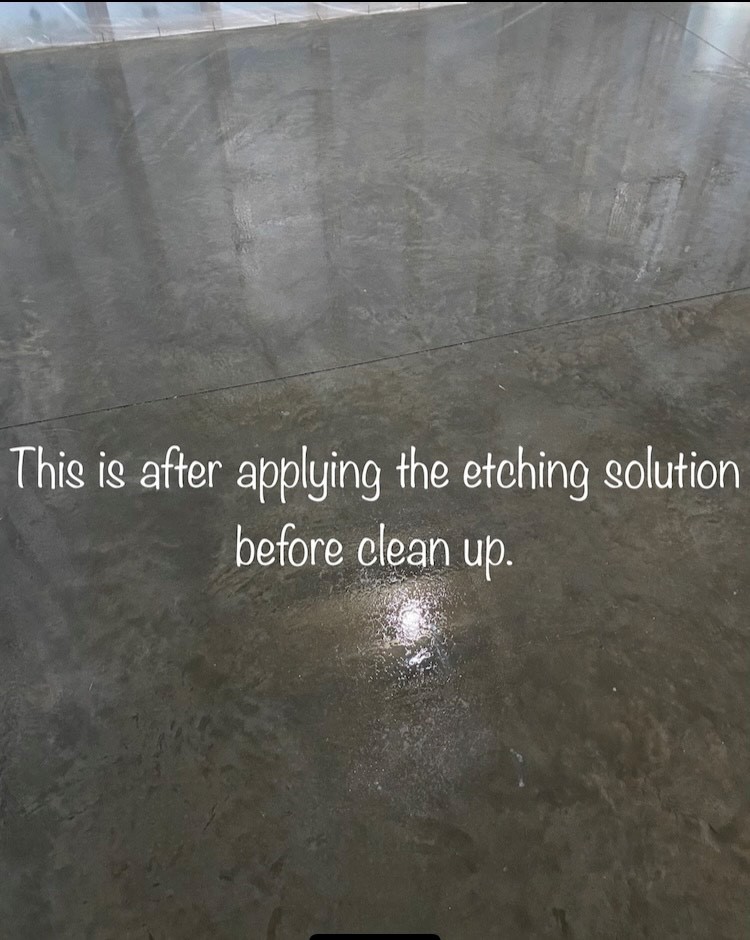 Image of etching solution being applied on the surface of a machine troweled concrete floor, creating a rough surface for acid staining