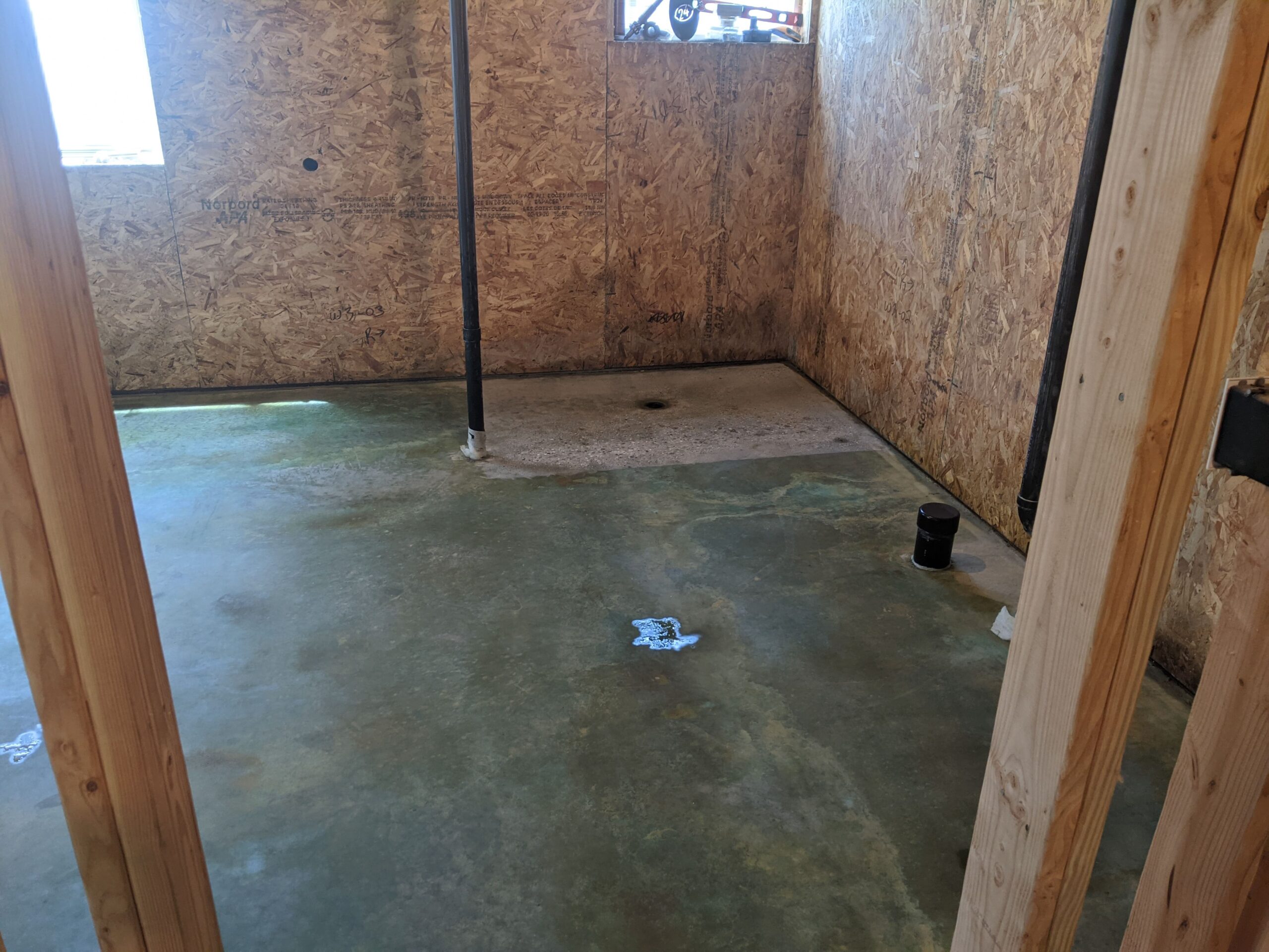 Photo showcasing the walkout basement floor after application of Avocado EverStain Acid Stain