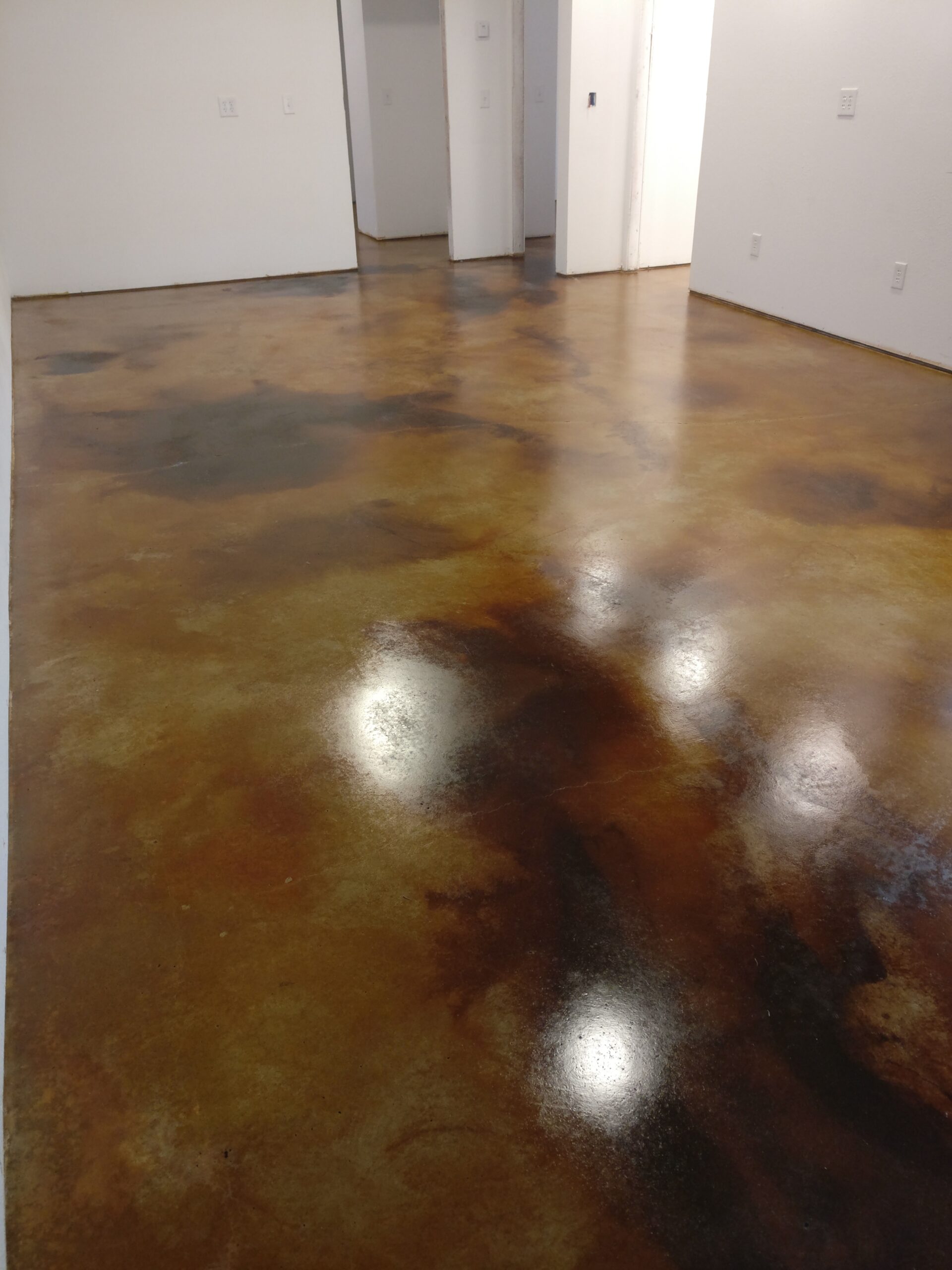 Stained concrete basement floor with Malayan Buff, Coffee Brown, Desert Amber EverStain acid stains