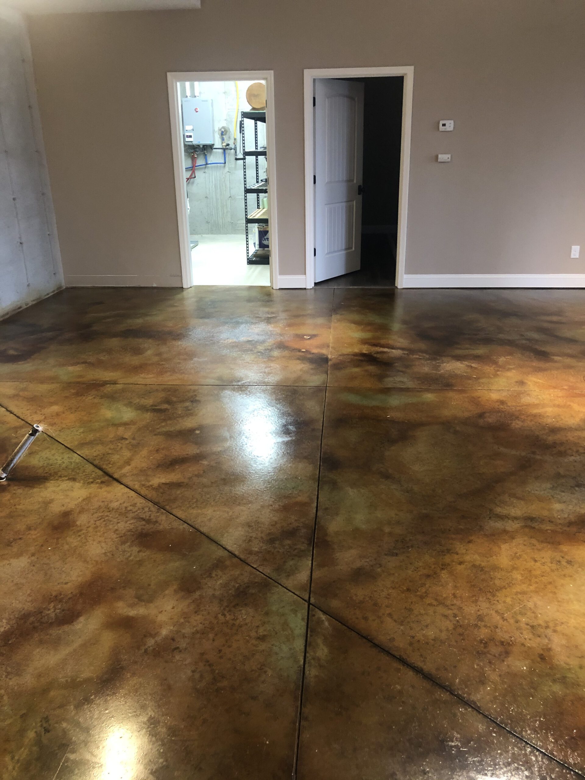 Marbled acid stained concrete basement floor