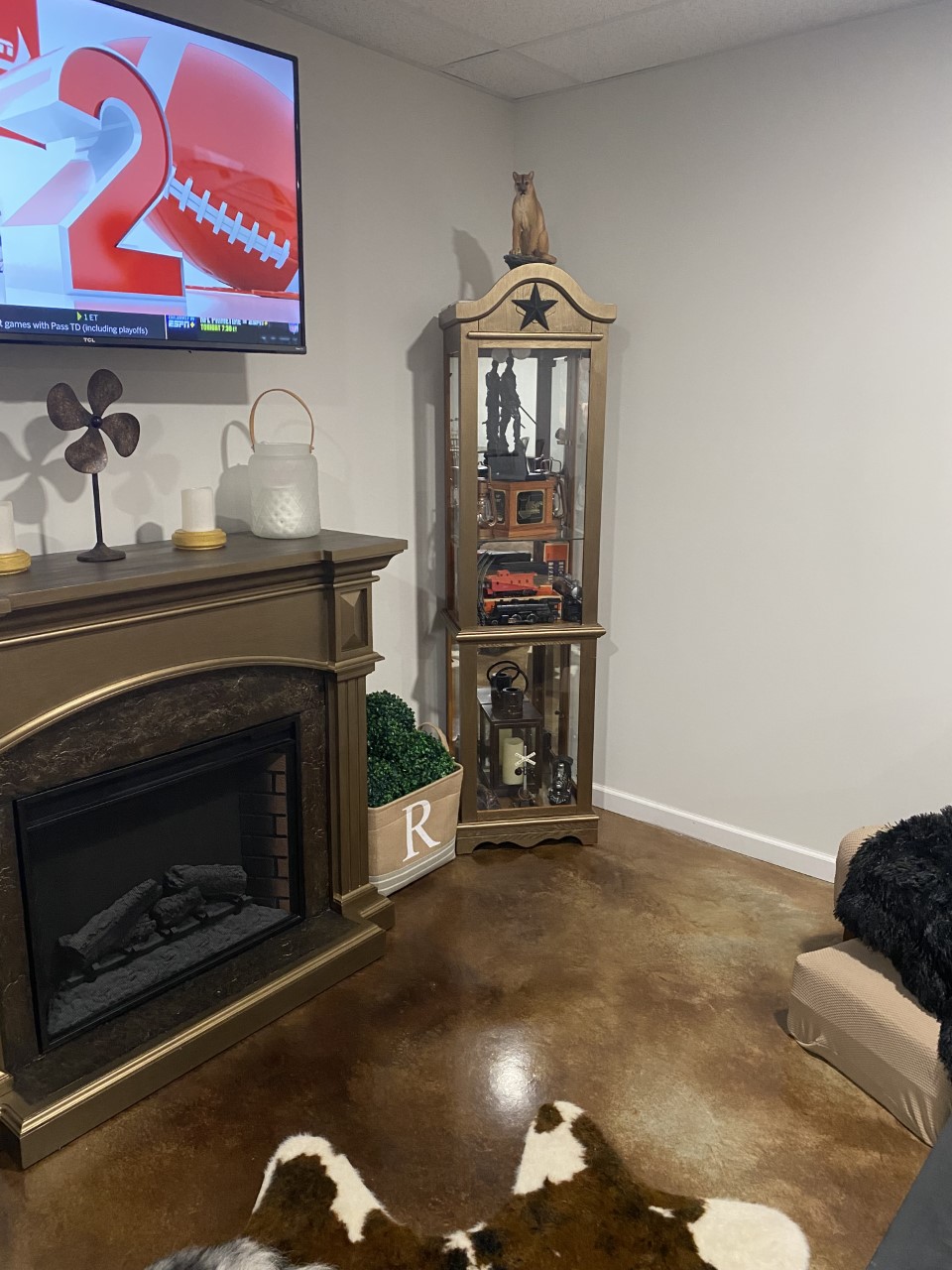 Stunning rustic family/rec room featuring a concrete floor stained with desert amber and coffee brown acid stain