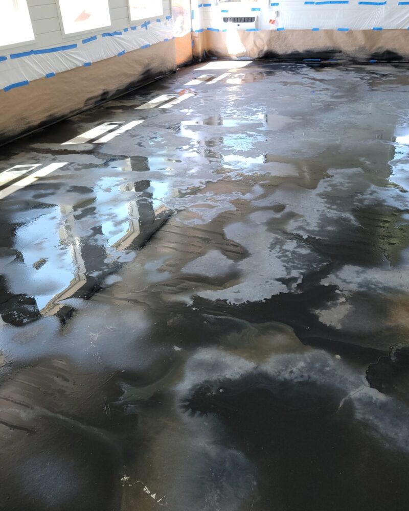 ColorWave Stains in Black, Stone Gray, and Iron Gray Applied Using Puddling Method on Concrete Floor