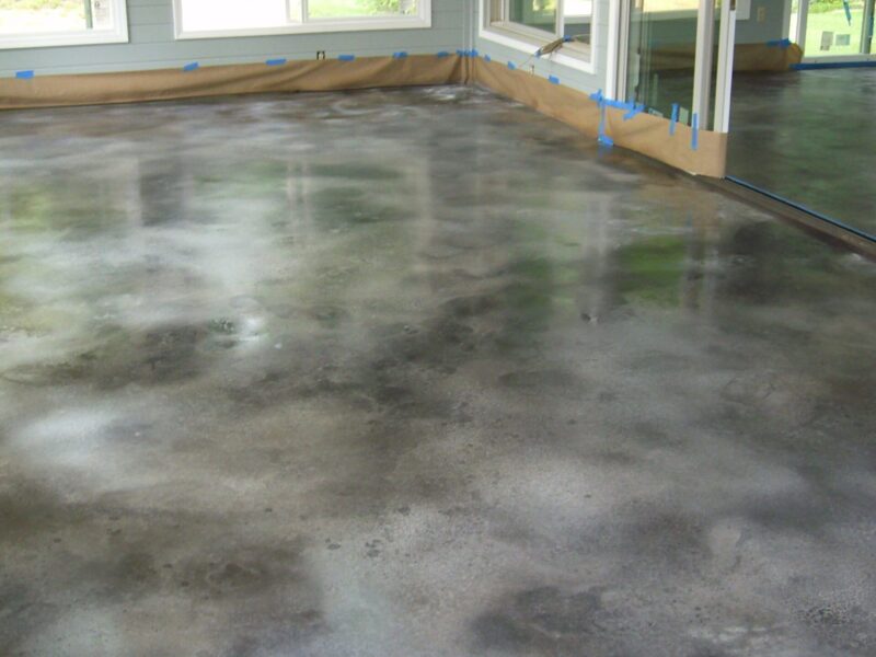 Sunroom floor stained with black and white Vibrance Dye in mottled technique