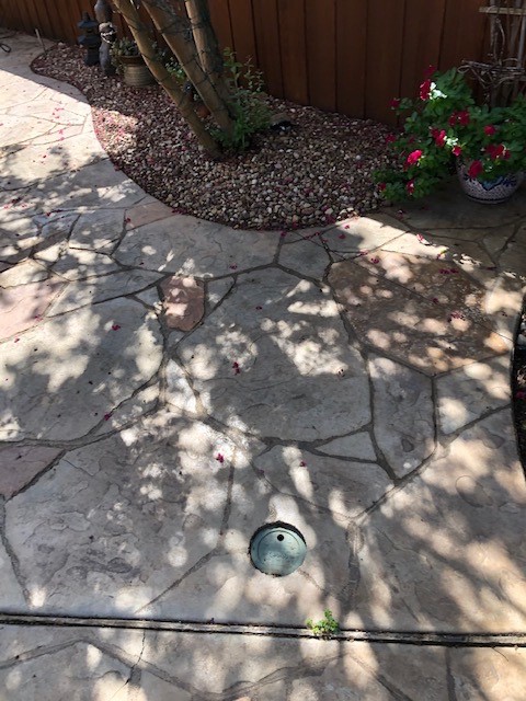 Faded stamped concrete patio