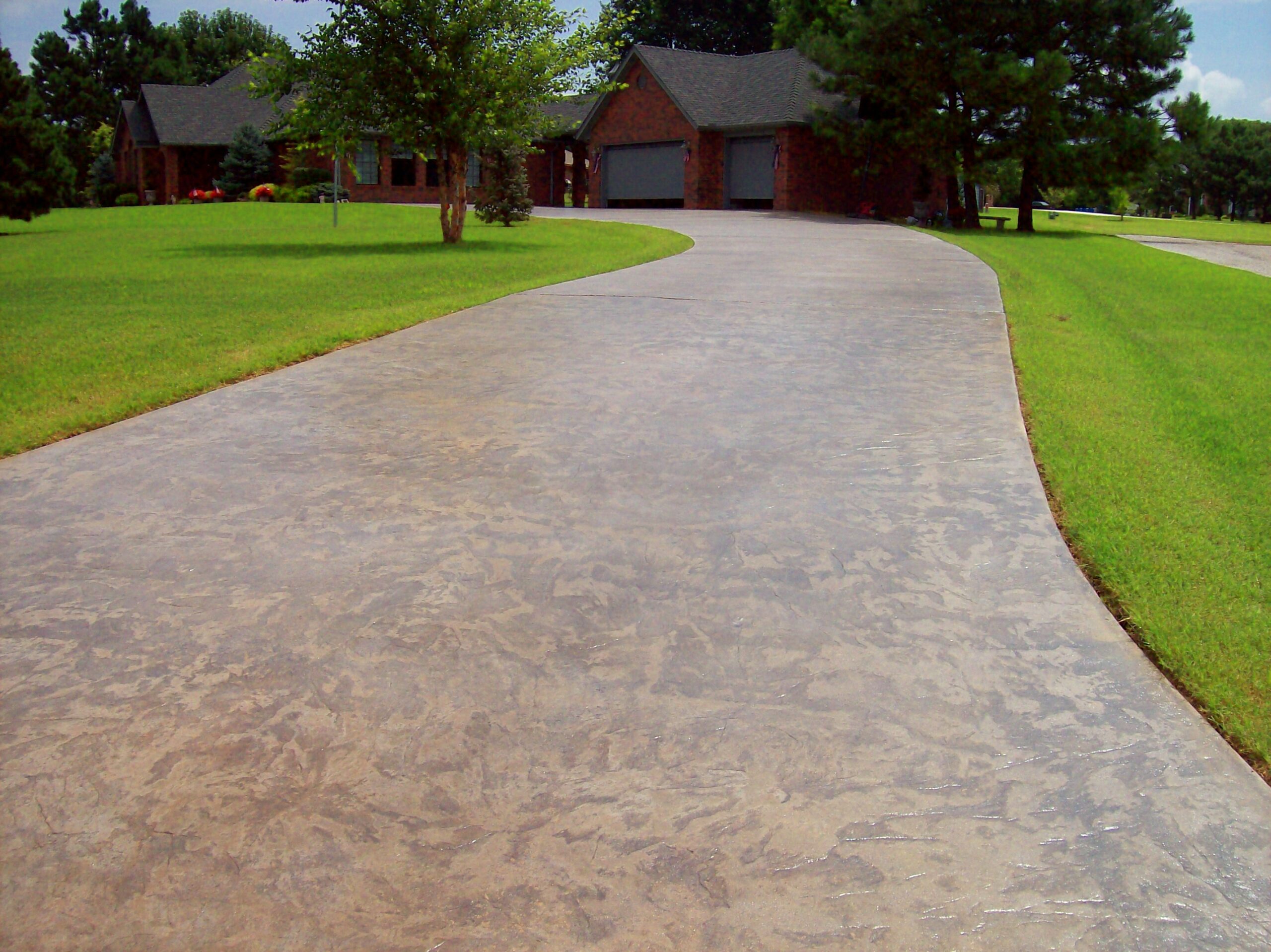 Auburn Antiquing Stain on Integrally Colored Stamped Driveway