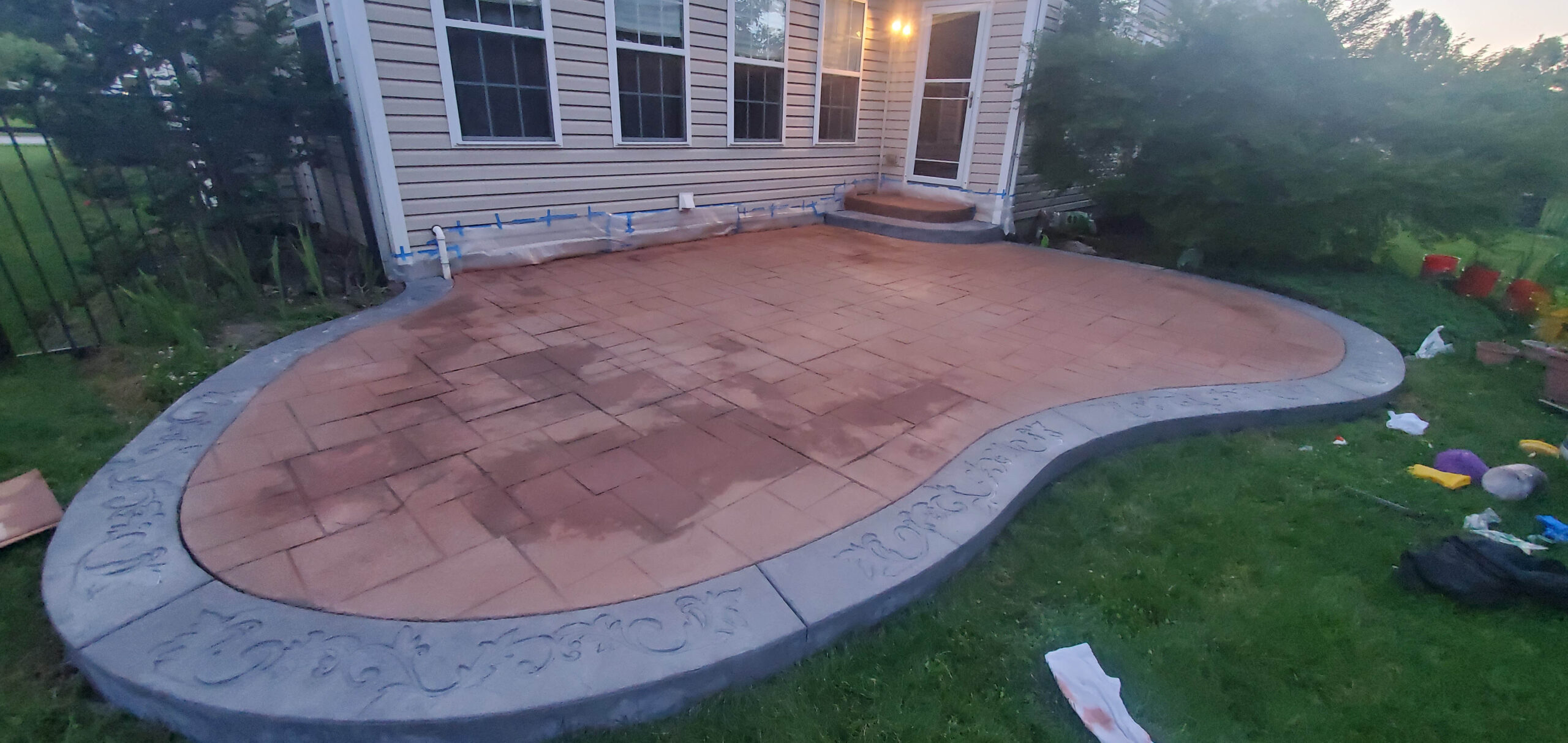 Application of Russet & Eagle Grey Antiquing Stains on Stamped Concrete Patio
