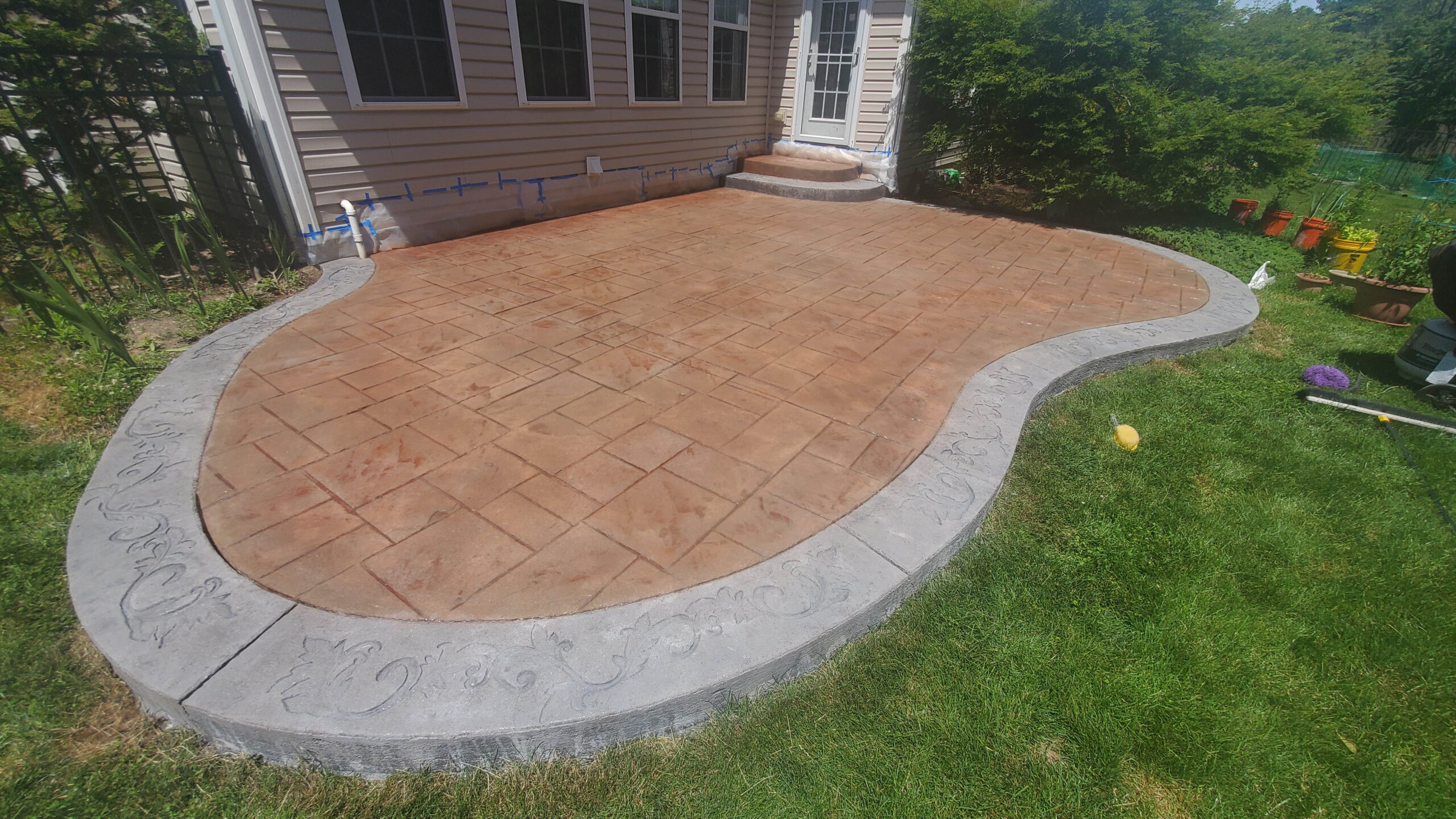 Russet & Eagle Grey Antiquing Stains on Stamped Concrete Patio