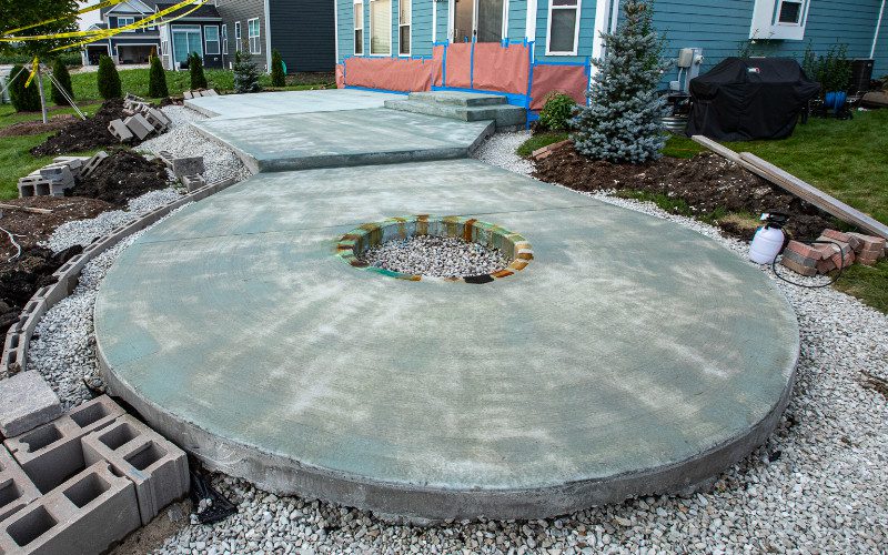 Round concrete patio with base coat of Seagrass EverStain acid stain