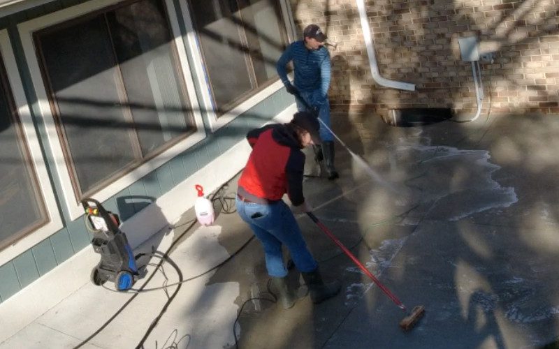 Concrete patio being cleaned