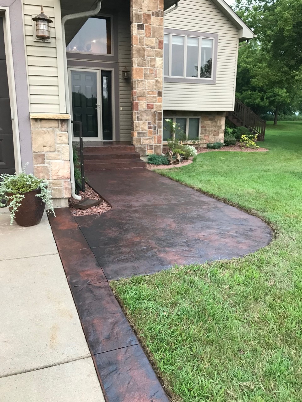 Stained Residential Walkway with Light Charcoal over Old Pink