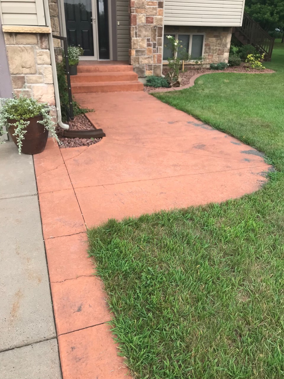 Faded Residential Concrete Walkway Porch