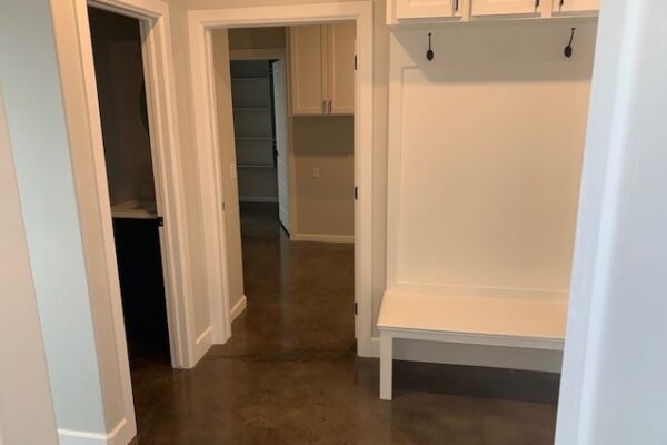 Foyer featuring a concrete floor dyed with an elegant combination of Stormy Gray, Driftwood, and Charcoal Vibrance Dye