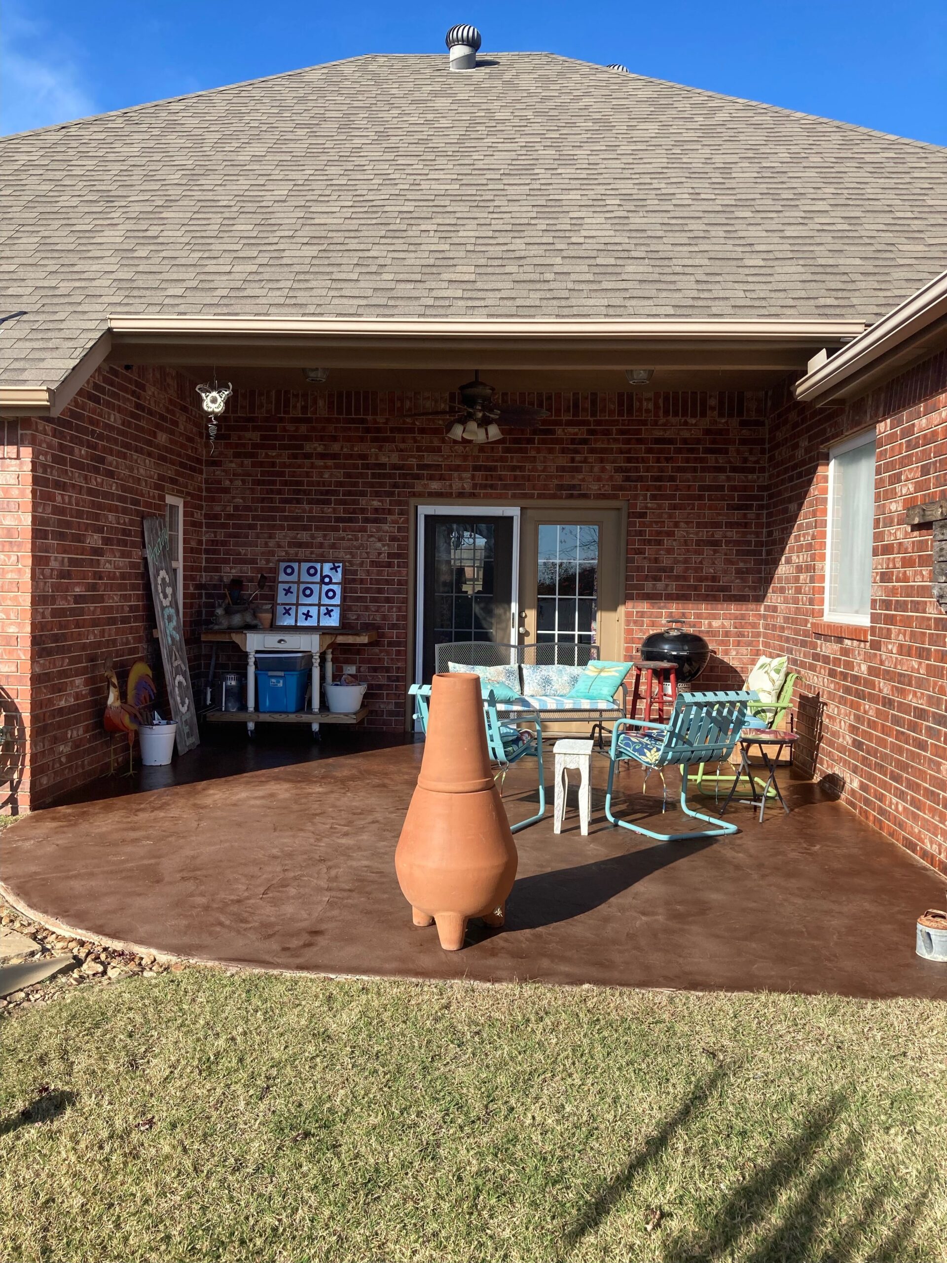 An after photo of a covered concrete patio stained with Chocolate EasyTint™