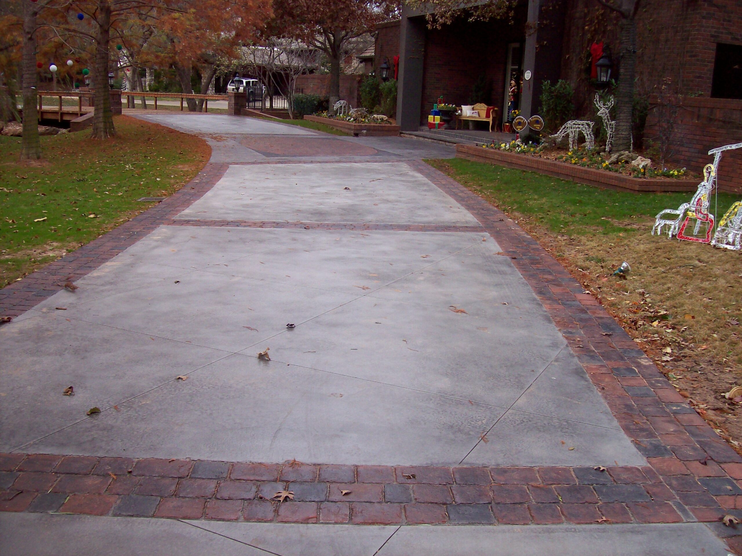 Milano Red and Charcoal Stained Concrete Paver Driveway