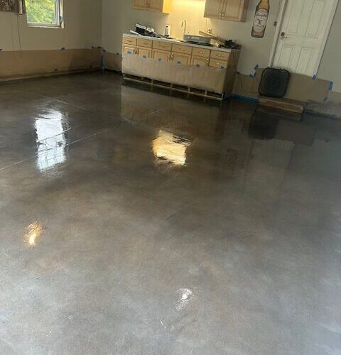 Finished garage floor with a sleek, polished look using charcoal, stormy gray, and white Vibrance dye.