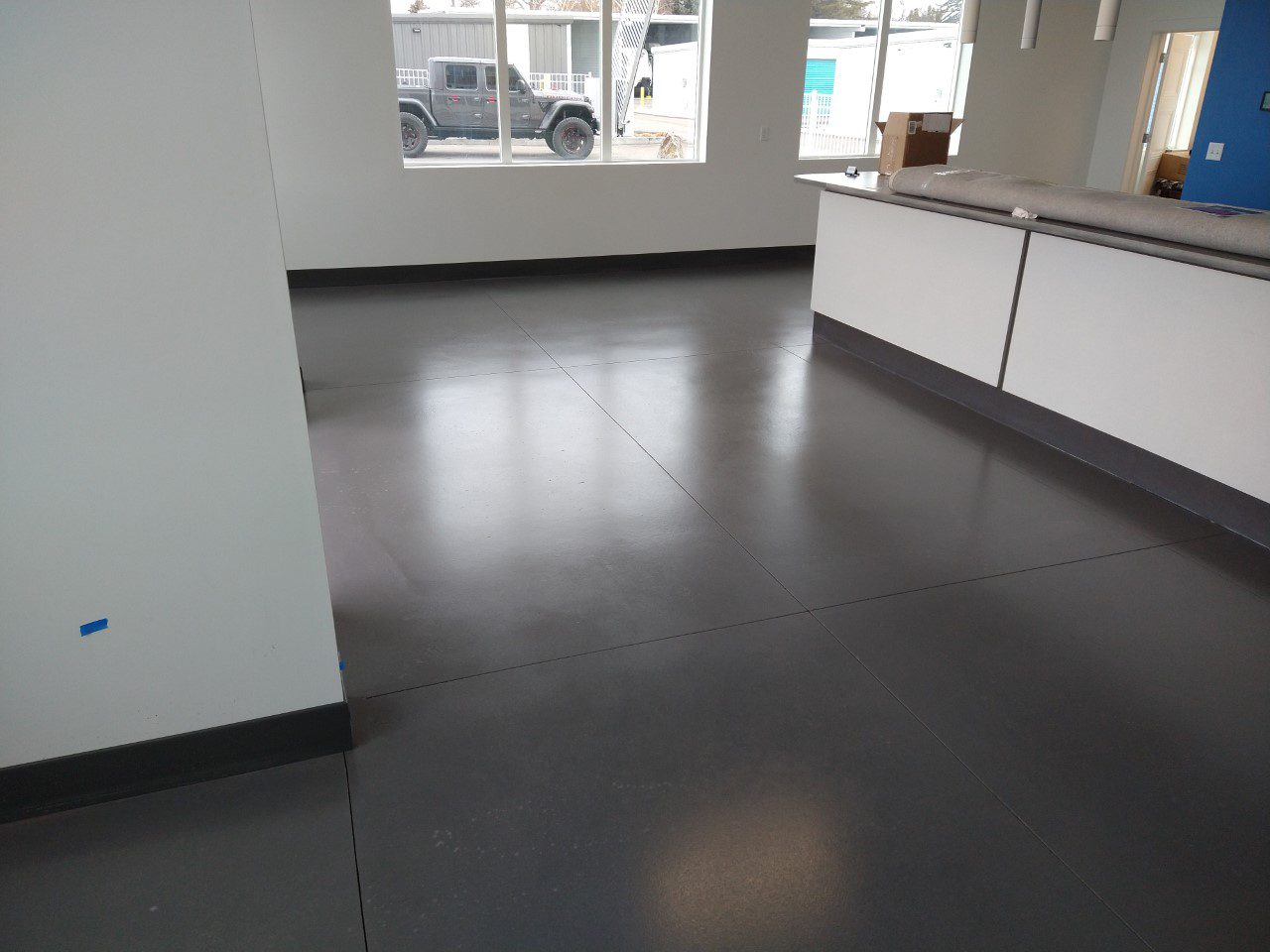 Commercial concrete floor transformed by Silver Gray AcquaTint