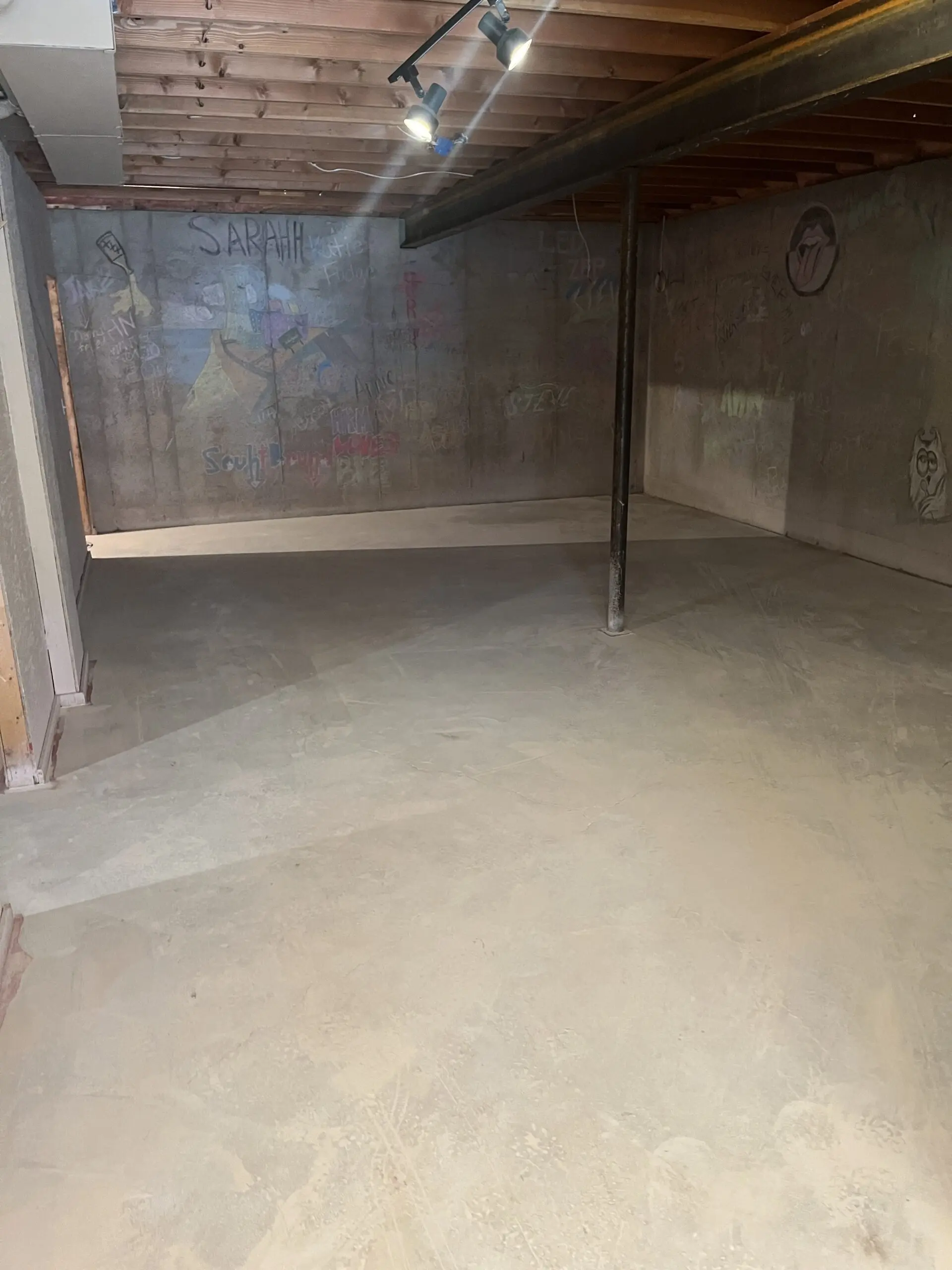 Basement floor after grinding process, preparing for staining