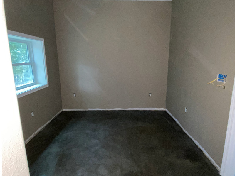 Charcoal stained concrete basement floor