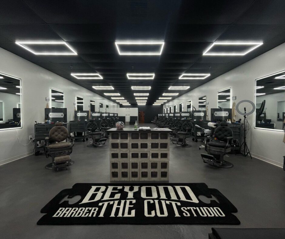 Image showcasing the finished concrete floor in the newly opened barbershop, featuring modern, industrial aesthetics with varying tones of gray and black, exuding a masculine ambiance.