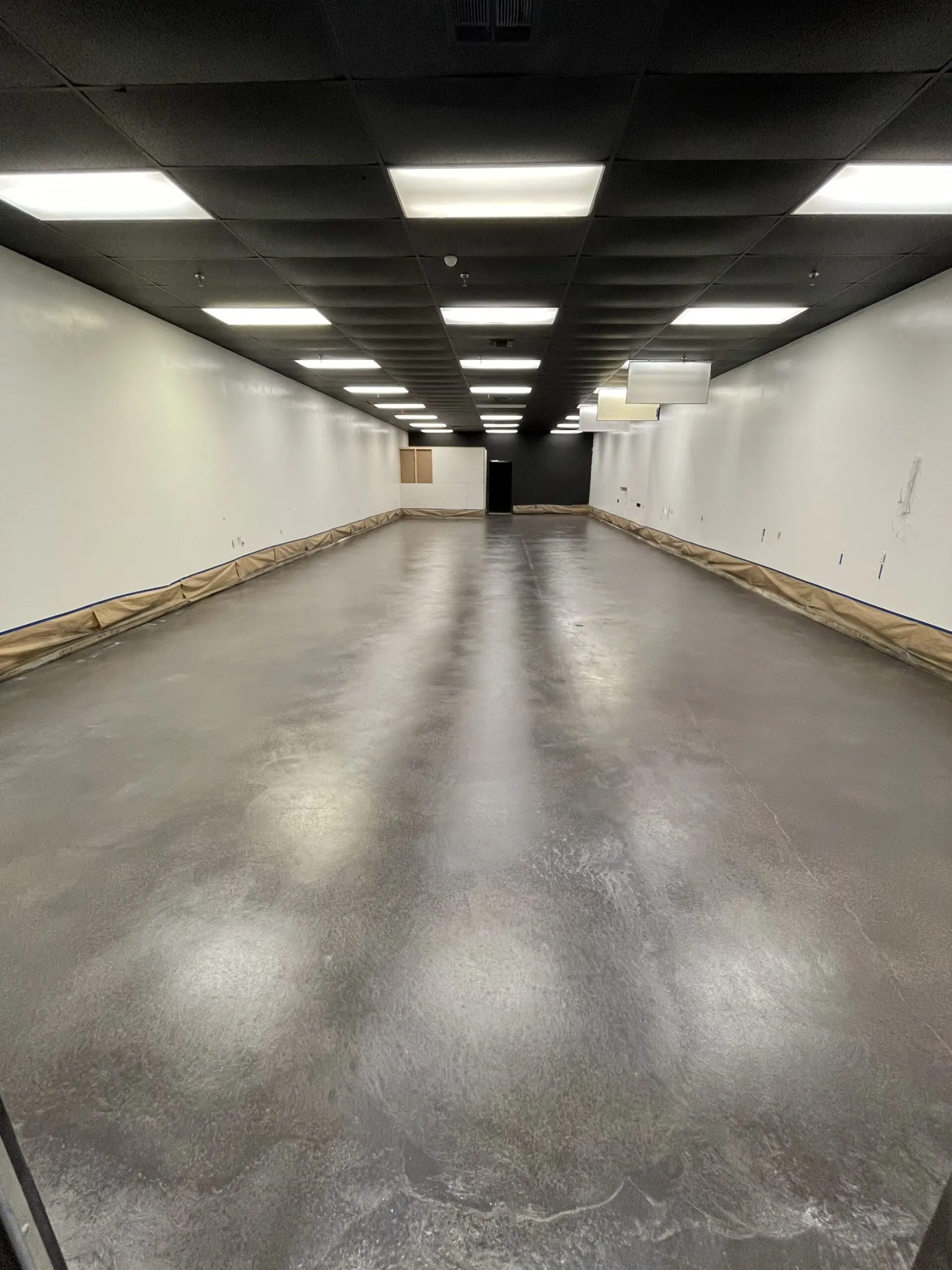 Image showing the floor after the application of the second coat of Charcoal Acquatint, as it awaits curing before the application of ProWax Polish