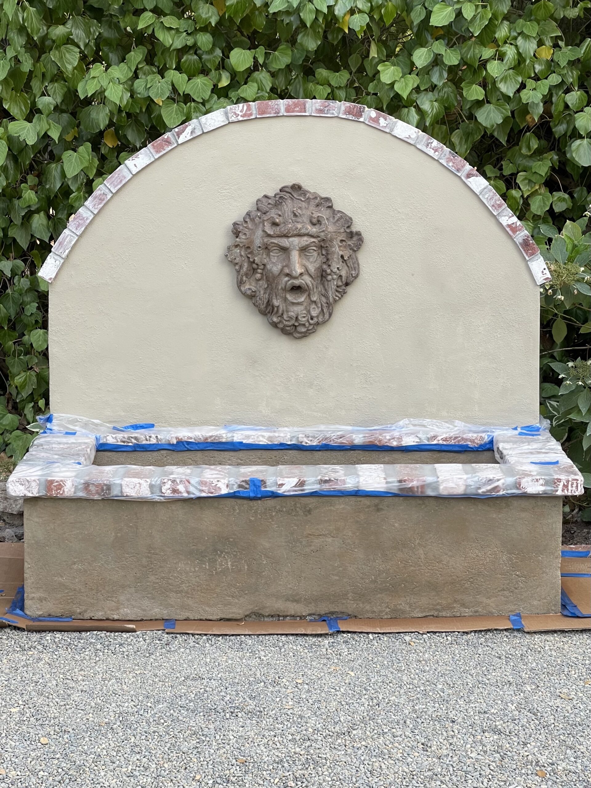 The concrete wall fountain after the application of Cumin Antiquing stain