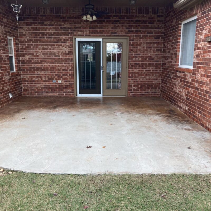 A before photo of a plain covered concrete patio