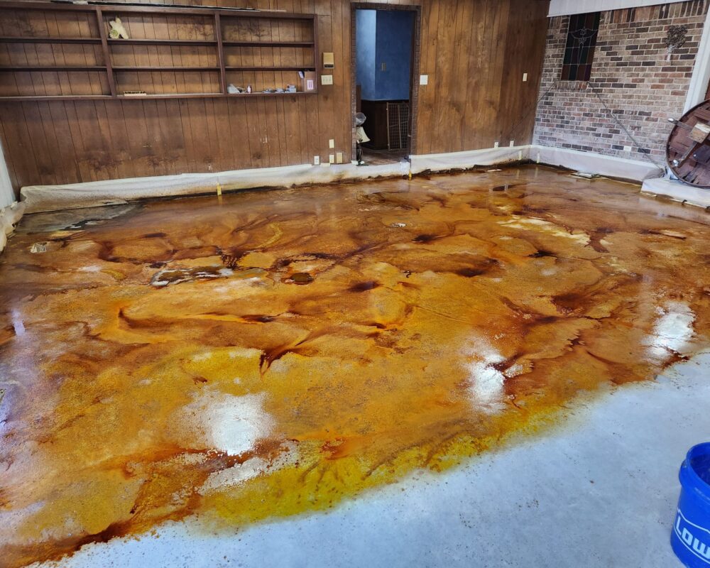 Concrete floor of the game room post application of Cola, Coffee Brown, and Desert Amber EverStain™ acid stains