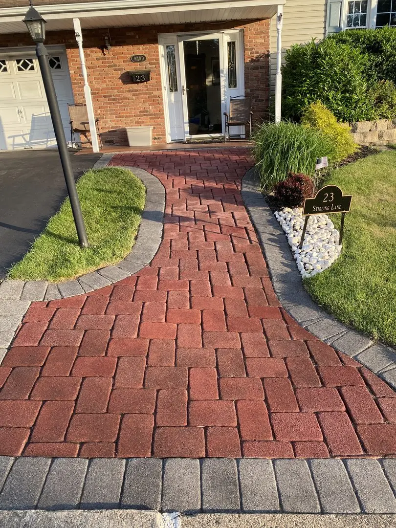 Paver walkway now stained in Milano Red with Charcoal accents