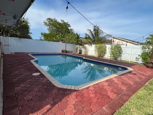 Chocolate & Milano Red Stained Concrete Paver Pool Deck