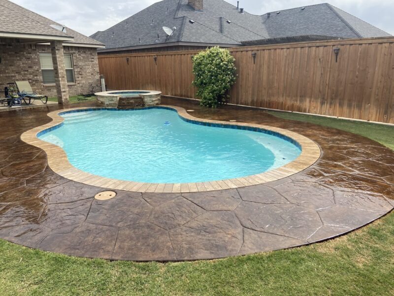 The revitalized pool deck, post-application of Coffee Brown EverStain™, showing off its vibrant, glossy finish
