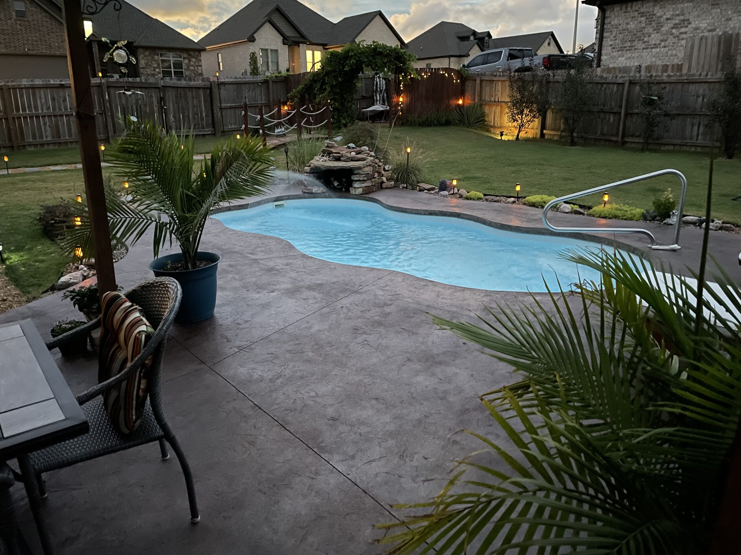 Aztec brown Antiquing stained broomed concrete pool deck