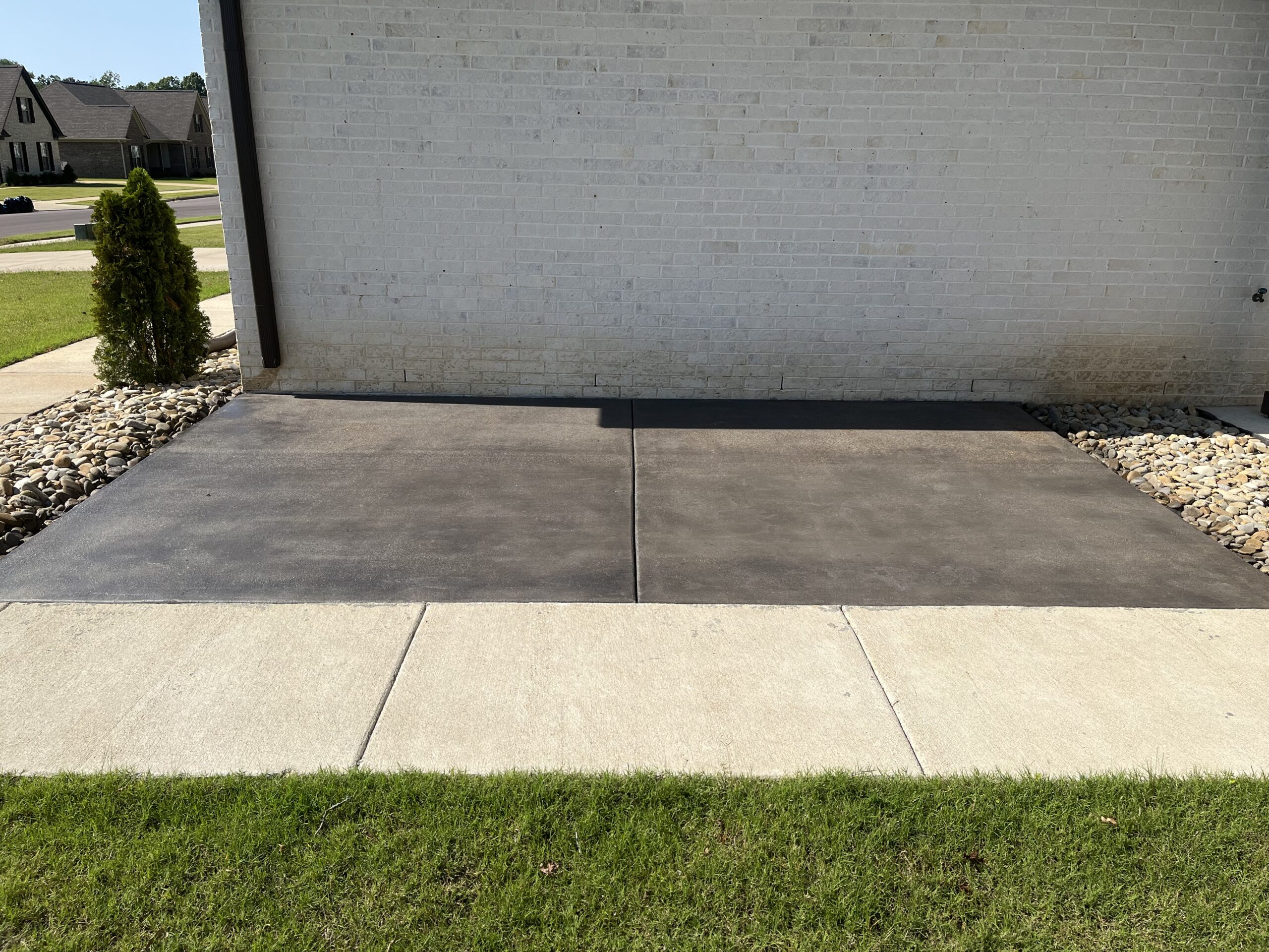 Antiquing Charcoal stained broom finish concrete patio