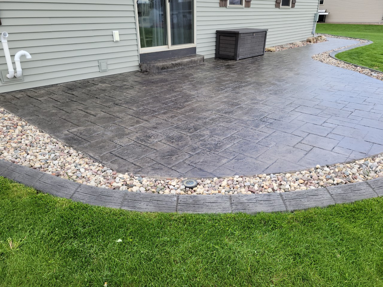 Antiquing Charcoal stained stamped concrete patio