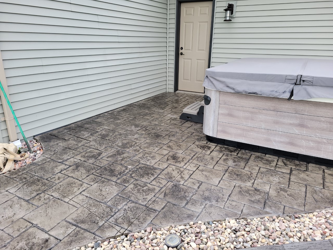 Antiquing Charcoal stained stamped concrete patio