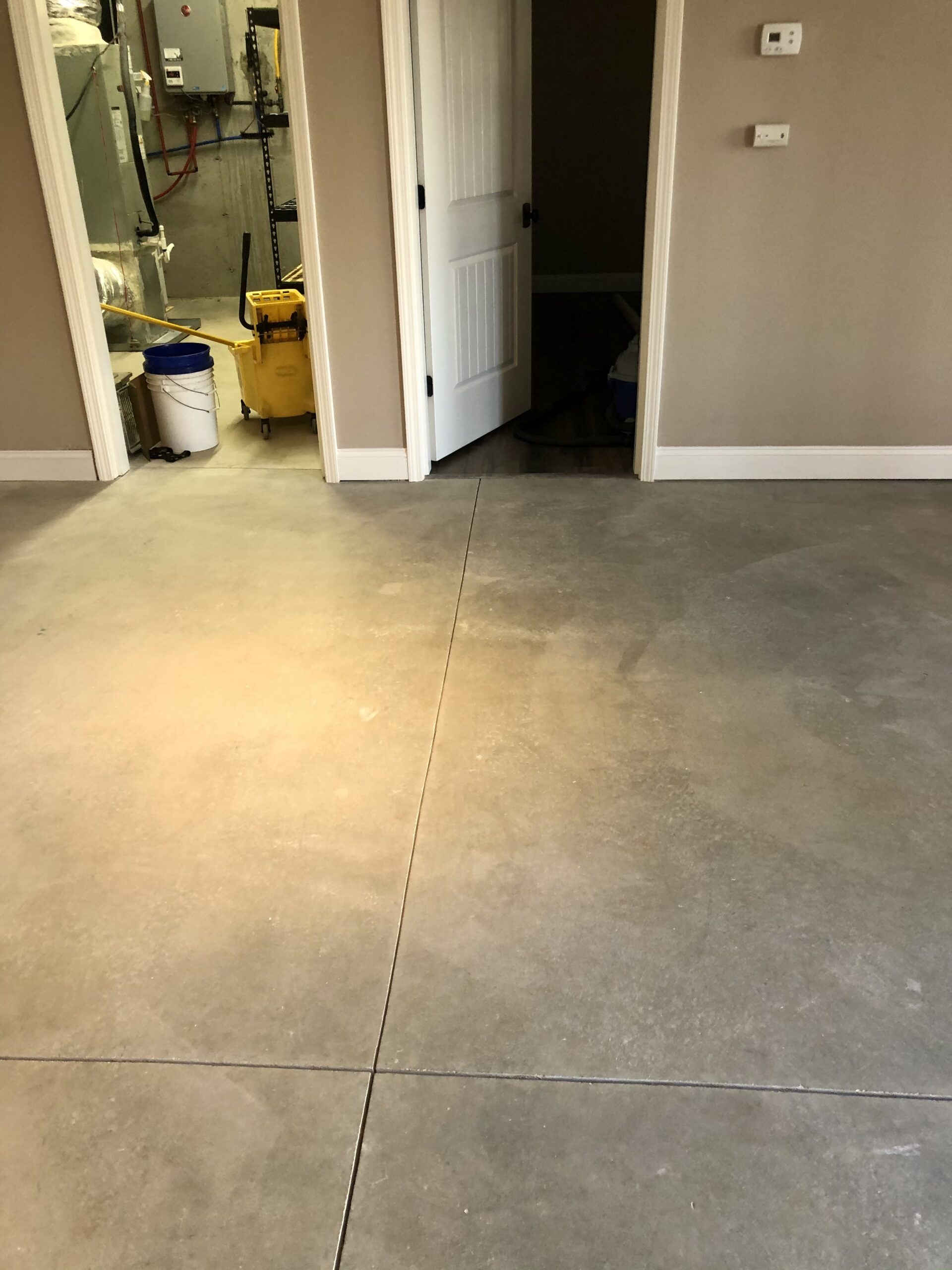 Concrete basement floor before acid stain