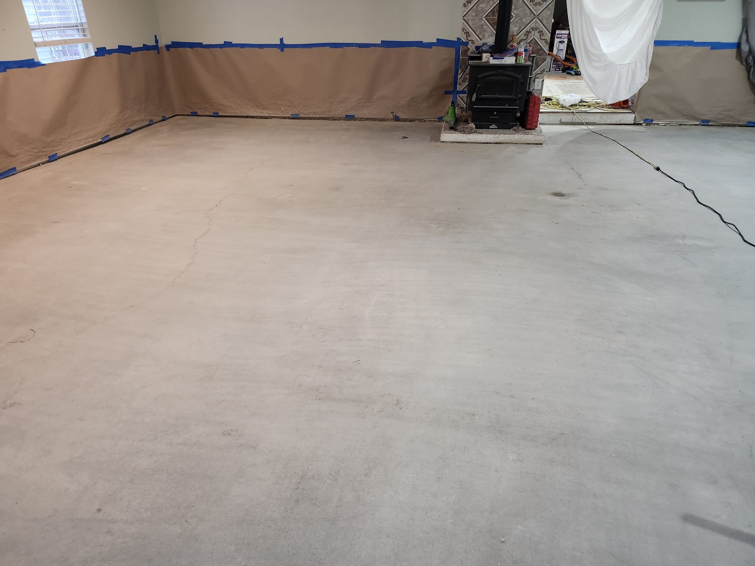 After Cleaning - Smooth, clean concrete floor, free of carpet glue and ready for dye application
